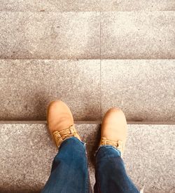 Low section of man standing on floor