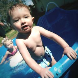 Portrait of boy playing in pool