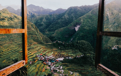 Scenic view of mountains seen through window