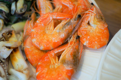 Close-up of prawns in plate on table