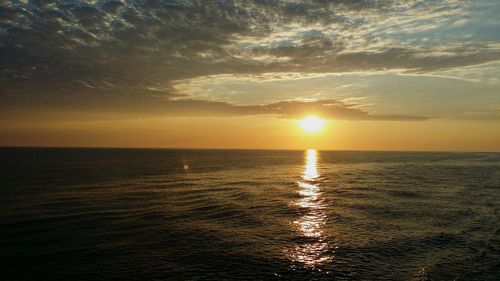 Scenic view of sea at sunset