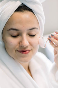 Close-up of young woman with dentures