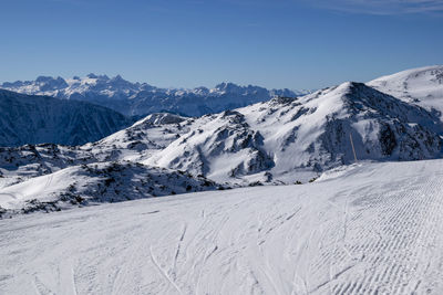 Scenic view of snowcapped mountains against sky