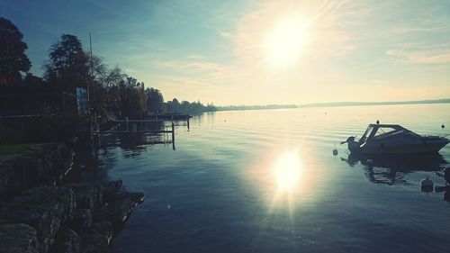 Scenic view of lake against sky during sunset