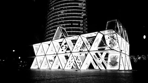 Low angle view of illuminated building at night