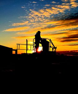 Silhouette people at sunset