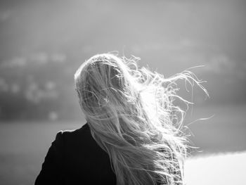 Close-up of woman against sky