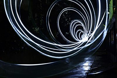 Close-up of spiral water at night