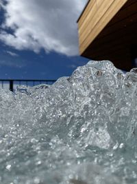 Close-up of frozen sea against sky