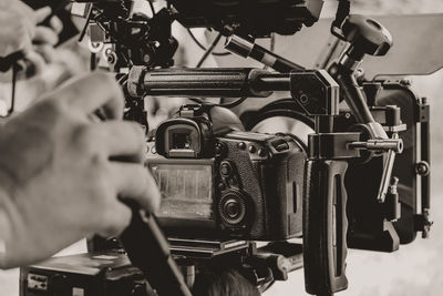 Close-up of man repairing machinery