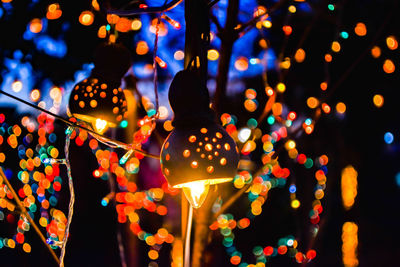 Close-up of illuminated christmas lights at night