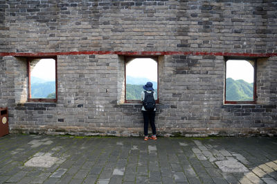 Person standing at great wall of china window