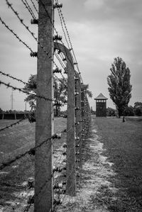 Built structure on field against sky