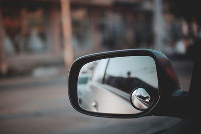 Close-up of reflection on side-view mirror