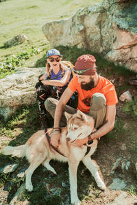 Full length of couple with dog