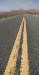 Surface level of road against sky in city