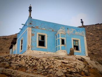 Low angle view of old building against clear sky