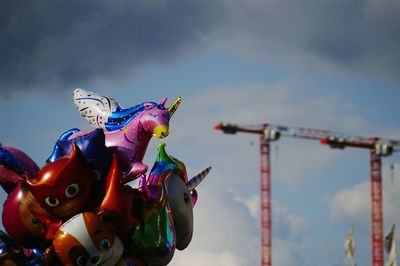 Low angle view of amusement park ride against sky