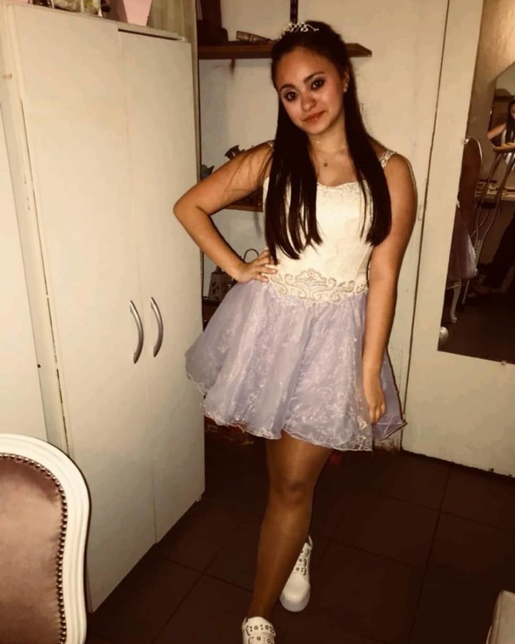 one person, standing, looking at camera, young adult, portrait, women, young women, full length, indoors, front view, beautiful woman, fashion, real people, beauty, smiling, leisure activity, lifestyles, adult, hairstyle, flooring, mini dress, tiled floor