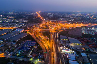 Aerial view of illuminated cityscape at dusk