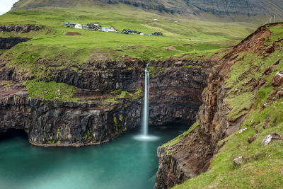 Scenic view of waterfall on mountain