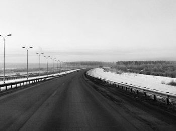 Empty road along landscape