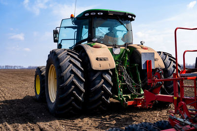 Panoramic shot of agricultural field against sky