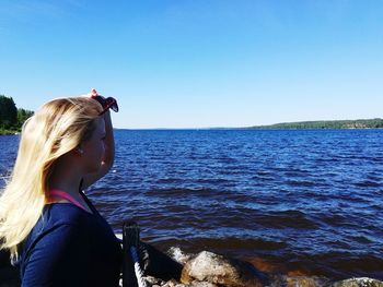 Rear view of woman looking at sea