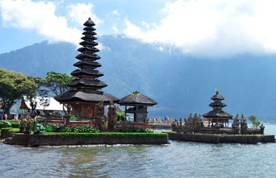 View of temple building against cloudy sky