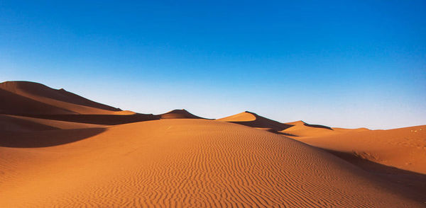 Scenic view of desert against clear sky