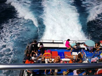 High angle view of people on boat in sea