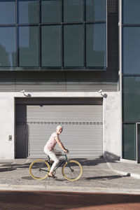 Mature man riding bicycle in the city