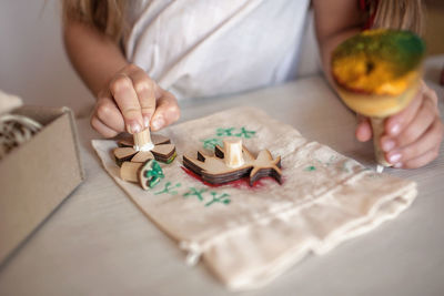 Midsection of woman preparing food on table