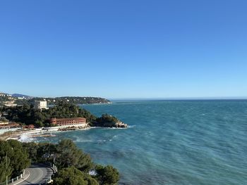 Scenic view of sea against clear blue sky