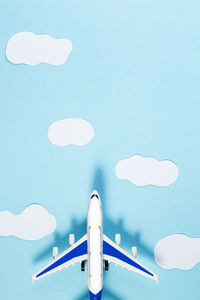 Low angle view of airshow against blue sky