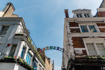 Low angle view of carnaby street sign in london