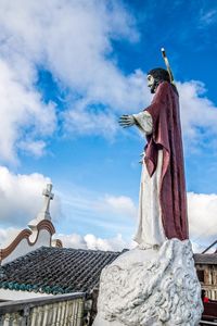 Low angle view of statue against sky