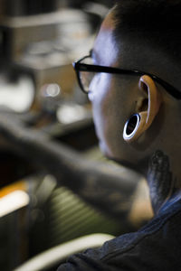 Close-up of man wearing earring