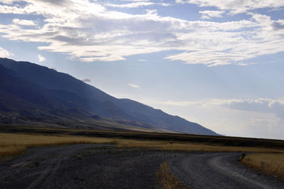 Scenic view of landscape and mountains against sky