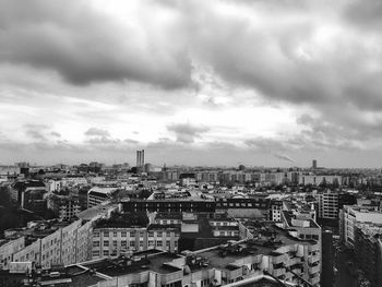 High angle view of city against cloudy sky