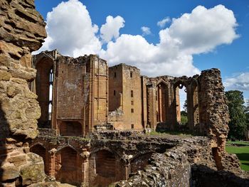 Old ruin building against cloudy sky