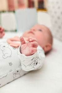 High angle view of cute baby girl holding gift