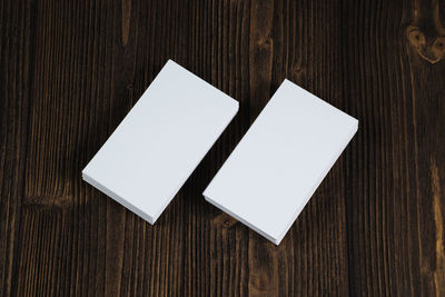 High angle view of paper on wooden table