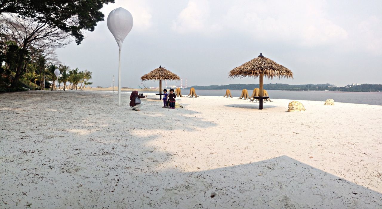 beach, sea, water, sky, leisure activity, lifestyles, sand, person, men, shore, vacations, horizon over water, incidental people, day, sunlight, large group of people, nature, tranquil scene, tranquility