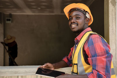 Portrait of man working at construction site