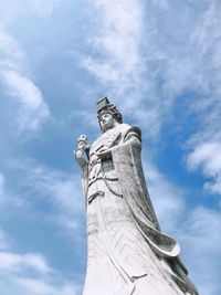 Low angle view of statue against sky