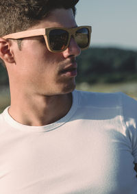 Close-up of young man wearing sunglasses