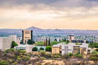 High angle view of buildings in city against sky