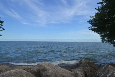 Scenic view of sea against blue sky