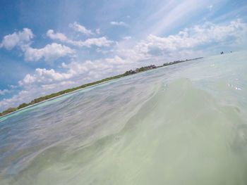 Scenic view of beach against sky